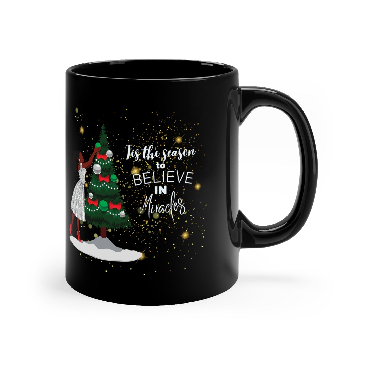 front view of black coffee mug with African American Woman celebrating christmas, decorating a Christmas tree. African American Christmas decorations. 